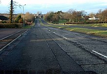 A section of former A74 near Lesmahagow. Its comparatively primitive specification compared to modern motorways drew strong criticism regarding the road's safety The old A74 dual-carriageway at Lesmahagow - geograph.org.uk - 289855.jpg