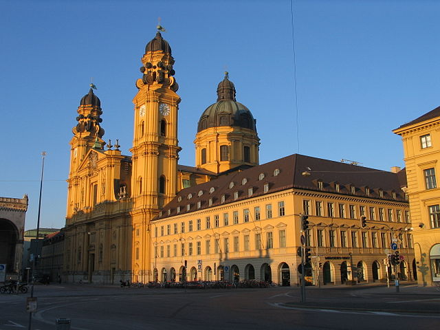 A photo of Munich in the evening, showing the Odeon Square