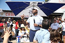 Scott speaking to supporters at the 2023 Iowa State Fair Tim Scott with attendees (53130692869).jpg