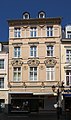 Simeonstraße 40: viergeschossiges Wohn- und Geschäftshaus mit opulenter Neurenaissancefassade, 1879/80, Architekt Peter Schneider