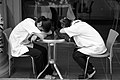 Two girls are sleeping on a table.jpg