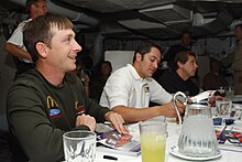 US Navy 050518-N-6484E-002 NASCAR Busch Series drivers sign autographs for Sailors aboard the Nimitz-class aircraft carrier USS Theodore Roosevelt (CVN 71).jpg