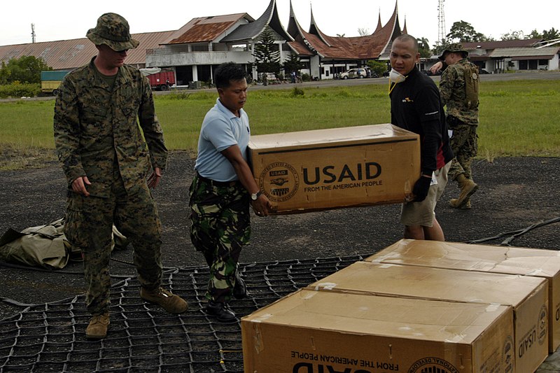 File:US Navy 091012-N-4917P-059 Workers load a cargo net of supplies from The United States Agency for International Development (USAID).jpg