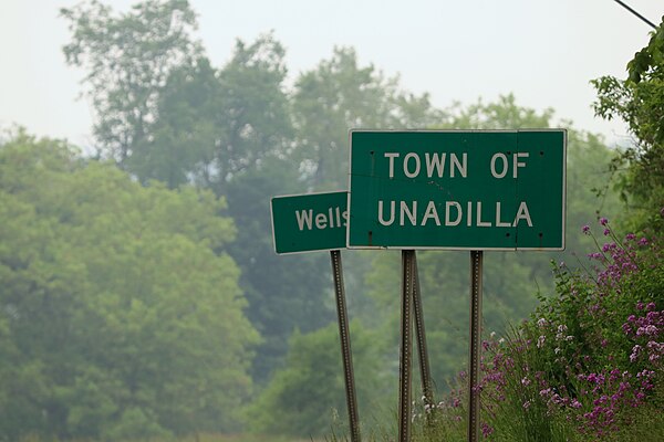 A sign for the town of Unadilla, New York, on New York State Route 7.