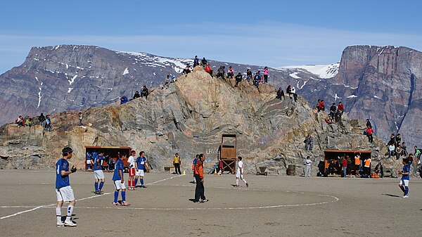 Football match in Uummannaq. Salliaruseq Island in the background