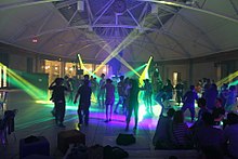 People dancing under disco lights