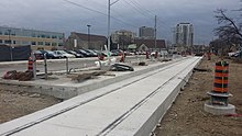 Willis Way station under construction in December 2015; both the embedded track and station platform have been poured Willis Way stn construction.jpg