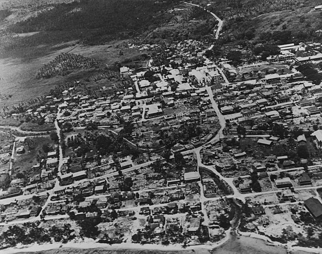 Aerial view of Hagåtña in 1943. The Plaza de España is in the upper right. The Agana River was rerouted by Navy Seabees after the Battle of Guam and n