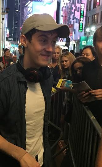 Sharp signing autographs at the stage door of The Curious Incident of the Dog in the Night-Time in 2015