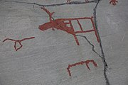 English: Rock art in the world heritage area in Alta, Norway. This is from the area Bergbukten 4b, a group of 195 figures. 22-24 m above sea level, and 6000-7000 years old.