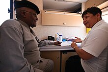 Tutu gets an HIV test on the Desmond Tutu HIV Foundation's Tutu Tester, a mobile test unit