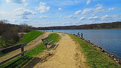 The levee overlooking Barton Pond Barton Dam (Michigan)2.jpg