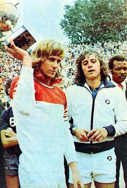 Borg (left) celebrating his win over Guillermo Vilas at the French Open final in 1975