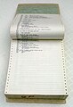 Listing of a large computer program on continuous form paper, bound in a printout binder.