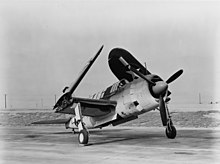A SB2A-3 with its wings folded and bomb bay open Brewster SB2A-3 with folded wings at NAS Patuxent River in November 1943.jpg