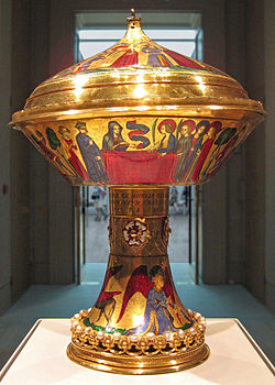 The Royal Gold Cup, 23.6 cm high, 17.8 cm across; weight 1.935 kg, British Museum. Saint Agnes appears to her friends in a vision. Before 1391, when it was owned by the King of France. One of a handful of medieval survivals, solid gold with enamels. British Museum Royal Gold Cup.jpg