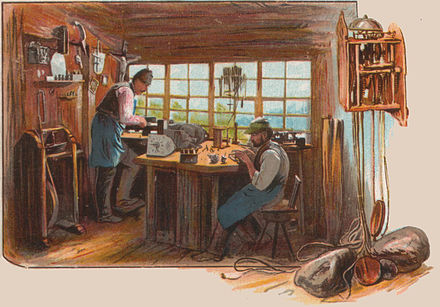 Clockmaker's workshop in a sitting room (postcard from around 1900)