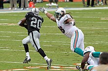 McFadden evades Paul Soliai in 2012. Darren McFadden - Miami Dolphins vs Oakland Raiders 2012.jpg