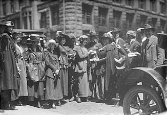 https://digitalcollections.lib.washington.edu/digital/collection/seattle/id/4325 These look more posed than others in this collection. Possibly an engagement, or seeing someone go off to World War I?