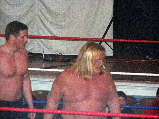 Valentine (right) in the ring with Reid Flair in 2009