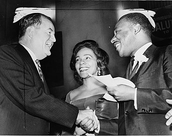 Vice President-elect Humphrey alongside Coretta Scott King and Civil Rights Leader Dr. Martin Luther King Jr. HHH-CKS-MLK-1964.jpg