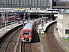 An S-Bahn train on line S3 departs Hamburg Hauptbahnhof in 2010 powered by the third rail; the retracted pantographs are just visible on the train roof