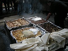 Preparation of a modern hangi for tourists at Mitai Maori Village, Rotorua. Hangi prepare.jpg