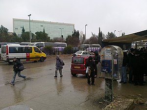 Site of the attack. The photo was taken a day after the attack. The damage from the blast is evident on the Payphone unit. Internation Convention Center Jerusalem.jpg