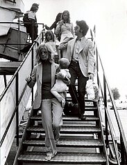 Paul and Linda McCartney in 1972, with Linda carrying their daughter Stella Linda-and-Paul-McCartney-1972.jpg