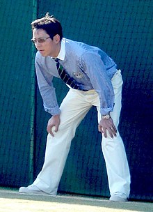 A line umpire stands at a ready position, focusing on his assigned line. Line umpire.jpg