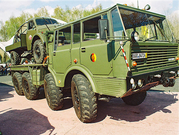 An NVA Tatra-813 carrying a GAZ-63