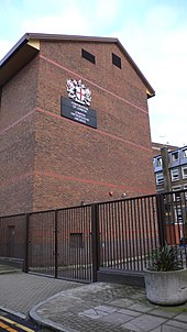 End of repository block, displaying the City of London coat of arms London Metropolitan Archives.jpg