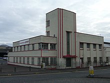 The office building of Longstone garage of Lothian Buses. This is the north east corner, as seen from the Longstone Road roundabout. The main shed is attached on the right. Since this shot was taken the garage has undergone a major extension, refurbishment and rebranding.