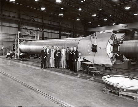 Astronauts and other officials in front of a Mercury-Redstone booster at NASA's Marshall Space Flight Center in Huntsville, circa 1960.