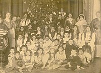 A New Year's tree in the house of Bala bey Ashurbeyov.In the bottom raw the first from the left side-Rasgad bey, the third-Sitara khanim, the fourth-Sara khanim, the fifth-Maryam khanim.