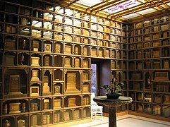 Interior of columbarium at Chapel of the Chimes in Oakland, California. Some of the cinerary urns are book-shaped.