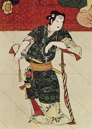 Okuni with cross dressed as a samurai.jpg