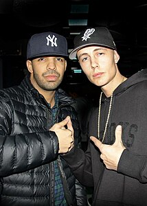 Ultralight/urban: Hip-hop artist Drake (left) wearing a thin down jacket