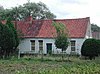 Arbeiderswoning met aangrenzende stalvleugel