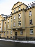 Three apartment buildings in half-open development in a corner