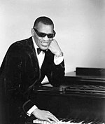 Ray Charles scored two top 10 entries in 1962, including his only UK number-one single, "I Can't Stop Loving You", which topped the chart for two weeks in July. Ray Charles classic piano pose.jpg