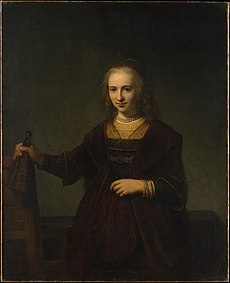 Rembrandt - Portrait of a woman holding a fan and the back of a chair.jpg