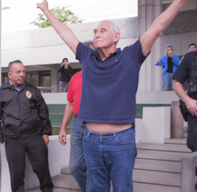 Stone making the V sign after his arrest and indictment, on January 25, 2019 Roger Stone making the V sign after his arrest and indictment.png