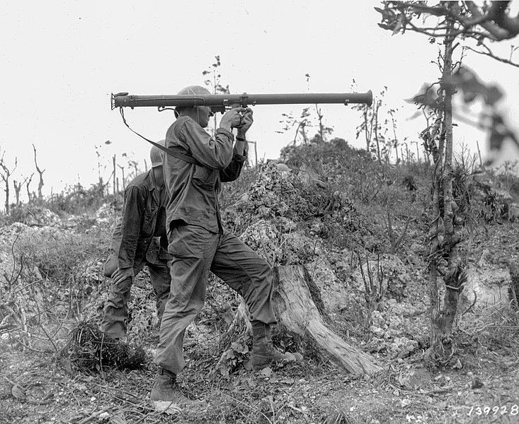 File:SC 139928 - Pfc. Alden A. Fisher, Morganton, Ga., fires a bazooka, Pfc. William Miller, Oceanside, Long Island, is the loader.jpg