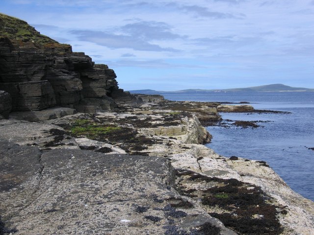 Cliffs in Saviskaill Bay on Rousay, looking northward to Westray across Westray Firth