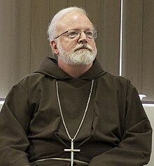 Sean Cardinal O'Malley (1001) was the archbishop of Boston. Scott Landry & Cardinal O'Malley (O'Malley cropped).jpg