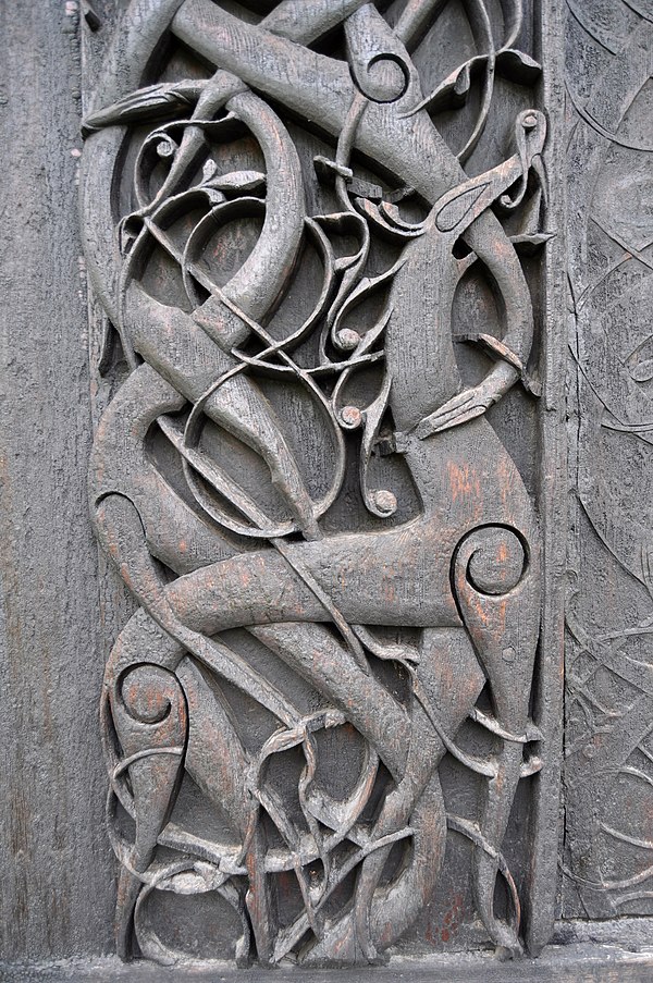 The north portal of the 12th-century Urnes stave church has been interpreted as containing depictions of snakes and dragons that represent Ragnarök.