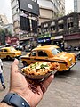 File:Street food & the iconic yellow taxi, Kolkata.jpg