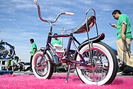 Lowrider bicycle on display in Downtown LA for the 8th annual Festival de los Gente (2007) Syd's Pink Lowrider Bike.jpg