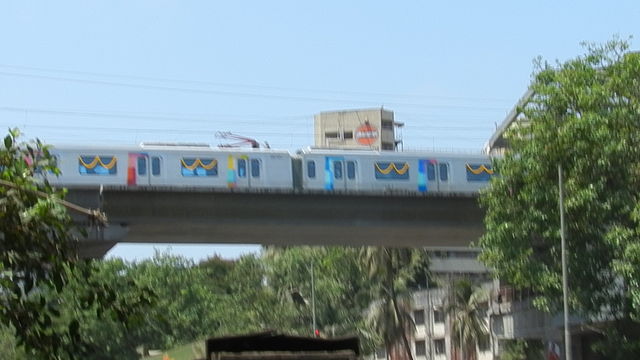 A metro train arriving at the D.N. Nagar station during the trial run in May 2013